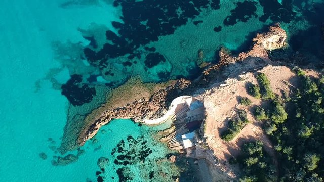 Ibiza summer. Cala Xarraca. Boat house on the coast. Ibiza. Sapin.