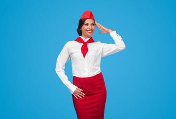 Positive flight attendant saluting and looking away