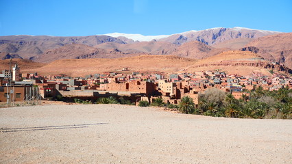 Bright landscape of Morocco, breathtaking curves of mountains, stunning combination of hills & farm land,inadvertent distribution of houses & huts, raw impression of pure nature.