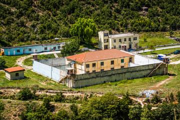 Fototapeta na wymiar Bence, Albania - August 02, 2014. Bence prison near Progonat in summer