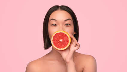 Asian woman with fresh citrus