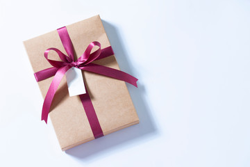 gift box red ribbon bow label tag copy space on white background