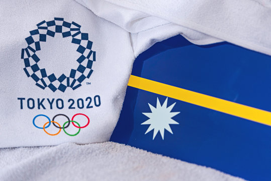 TOKYO, JAPAN, FEBRUARY. 4, 2020: Nauru National flag, official logo of summer olympic games in Tokyo 2020. White background