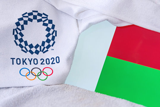 TOKYO, JAPAN, FEBRUARY. 4, 2020: Madagascar National flag, official logo of summer olympic games in Tokyo 2020. White background