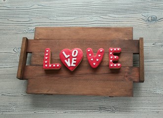 "I Love You" Spelled Out In Cookies On A Wooden Background