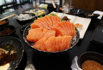Close-up view of delicious sushi, Salmon raw sashimi on dish in japanese restaurant.