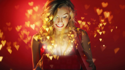 Naklejka premium Beauty happy girl with heart gift box.