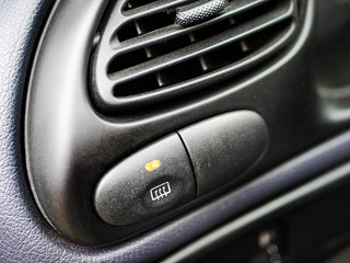 Obraz na płótnie Canvas Switch for heating on the old car