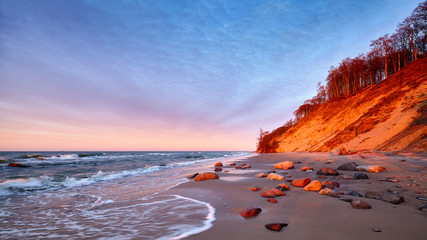 Cliff at a beach in Wolin National Park at sunset, Poland.