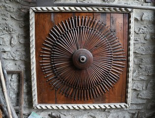 Old carriage wheel used as decoration in a house.Safranbolu