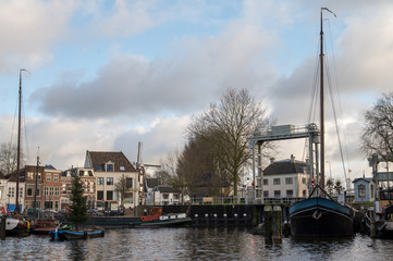 Fototapeta na wymiar View of Mallegat sluice in Gouda, the connection between the Turfsingelgracht and the Hollandsche IJssel. 