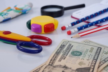 Money for school supplies. USA dollars. Back to school concept.