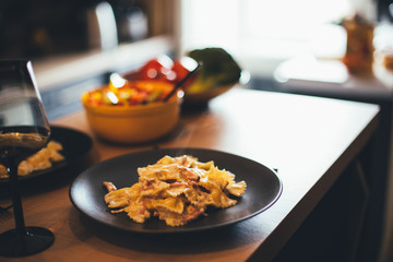 Fresh hot home made pasta on kitchen table.