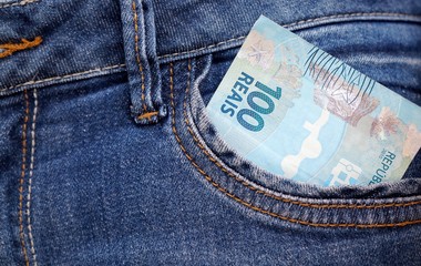 Brazilian money in a jeans pocket.