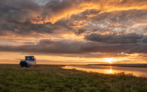 Fishing boat at Penclawdd Estuary at sunset