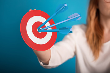 arrow hitting in the target center of dartboard on bullseye.
