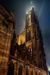 Fototapeta premium Stunning bottom view of Strasbourg Cathedral illuminated at night, Europe's tallest building.