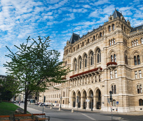 Fototapeta na wymiar Town Hall under blue cloudy sky in Vienna, Austria. Beautiful facade of Rathaus, gothic building