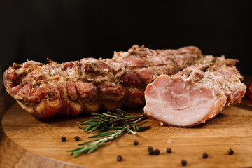Sliced smoked meat on wooden desk