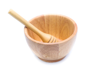 wood bowl with honey dipper isolated on white background