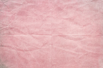 old wrinkled pink paper texture or background