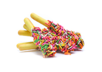 Biscuit stick bread with sweet colorful chocolate isolated on white background