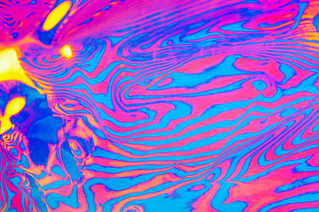 Abstract trendy neon colored psychedelic fluorescent striped zebra textured neon background