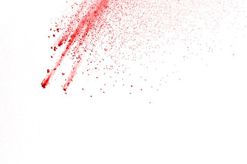 Red powder explosion on white background. Colored cloud. Colorful dust explode. Paint Holi.