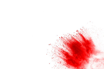 Red powder explosion on white background. Colored cloud. Colorful dust explode. Paint Holi.