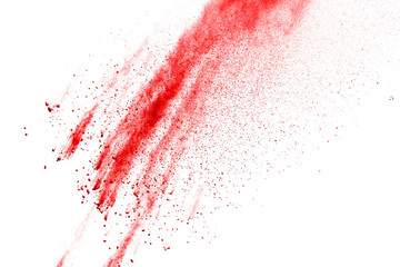 Red powder explosion on white background. Colored cloud. Colorful dust explode. Paint Holi.