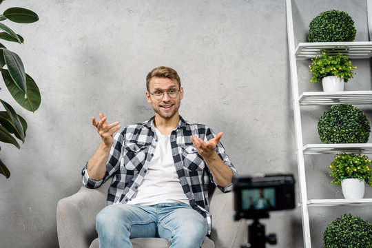Young adult social influencer creating media content for online