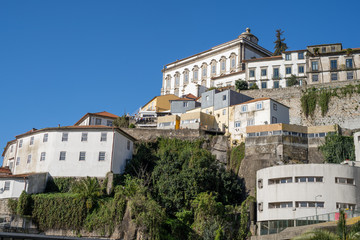 Fototapeta na wymiar Porto, Portugal - Colorful buildings in the Ribeira district, Porto's historical area overlooking the Douro river and Vila Nova de Gaia