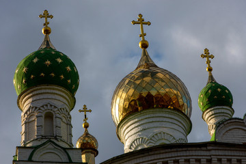 Fototapeta na wymiar Domes of Orthodox churches against the sky and clouds.
