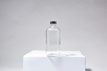 Portable glass bottles of various shapes and colors can hold essential oil, massage oil or...