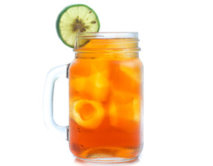 jar glass of iced tea with lemons  isolated on a white background