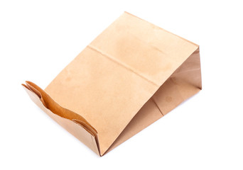 Brown paper bag on white background