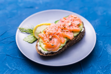 Sandwich with smoked salmon and cucumber. Concept for healthy nutrition.