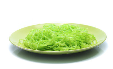 green noodles on dish isolated on white background