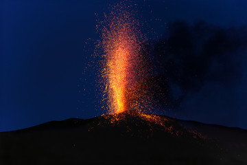 Fototapeta na wymiar explosive eruption at dusk in one of the three craters of the active stromboli volcano, eolian islands, italy.
