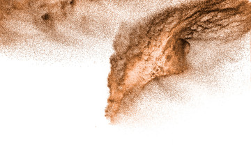 Fototapeta na wymiar Brown dry river sand explosion isolated on white background. Abstract sand splashing.