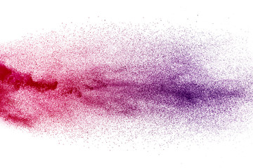 Freeze motion of purple color powder exploding on white background.