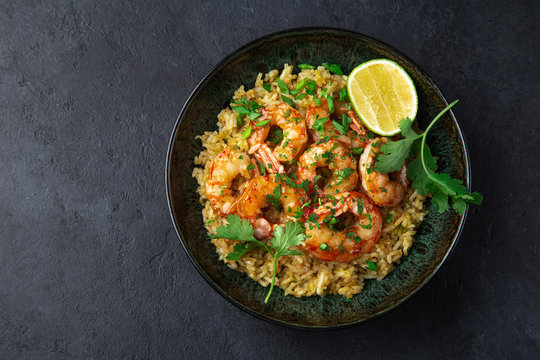 fried rice and prawn in  bowl