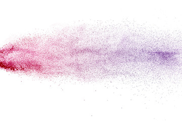 Freeze motion of purple color powder exploding on white background.