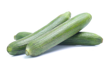 fresh green sponge gourd or luffa with slice isolated on white background