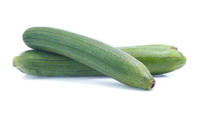 fresh green sponge gourd or luffa with slice isolated on white background