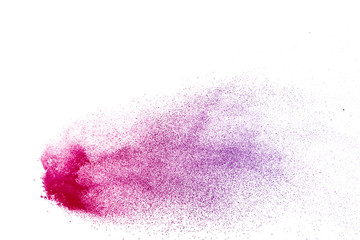 Freeze motion of purple color powder exploding on white background.