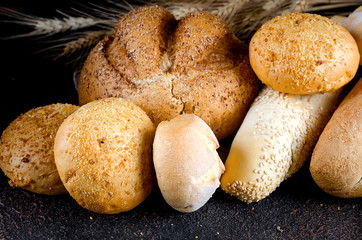 Assortment of baked goods on old dark wooden table