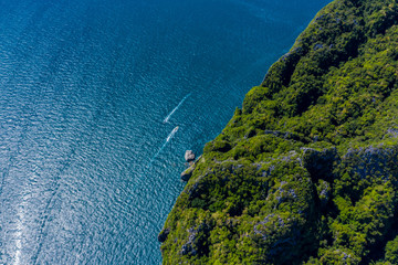 Aerial drone photo of iconic tropical turquoise water Pileh Lagoon surrounded by limestone cliffs,...