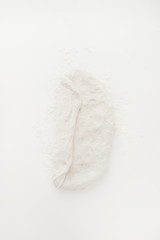 Baking cereal bread a Step by step guide to bake cereal bread,  top view on a white board, dough is spread to be executed the folding process