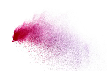 Freeze motion of purple color powder exploding on white background.